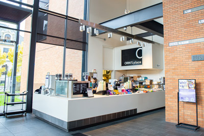 Barista at Orin's Place making espresso