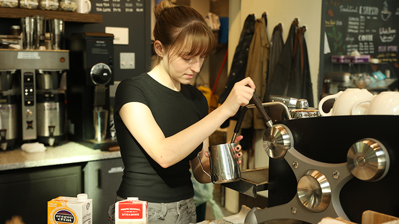 Husky Grind Barista pulling an espresso shot