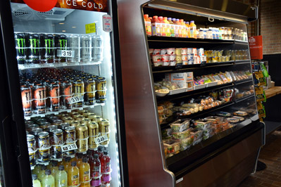 Display cases of snacks and beverages at Etc. market at the HUB 