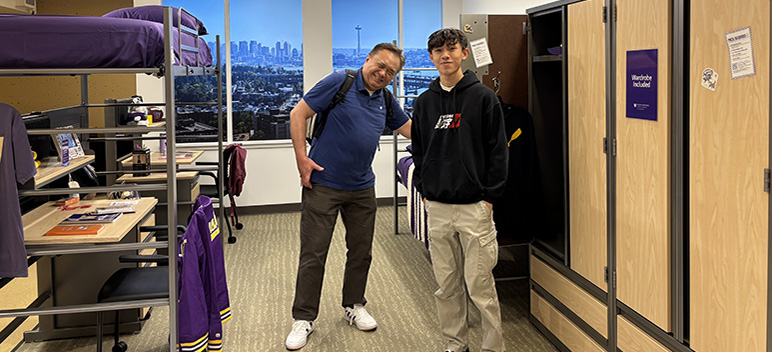 father and son in model room at University Book Store on the Ave in Seattle