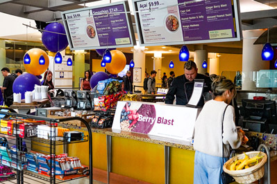 Customers enjoying smoothies at Dawg Bites in the UW IMA 