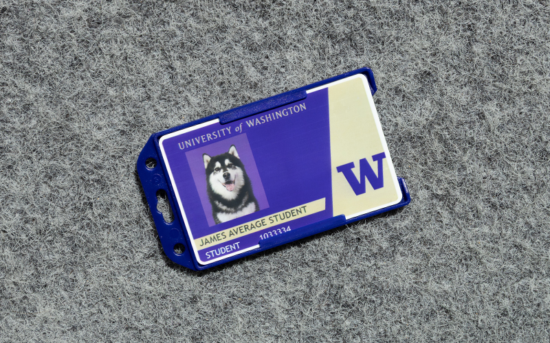 Blue plastic case to hold the Husky Card with a cut out at the top to attach a lanyard or badge reel.