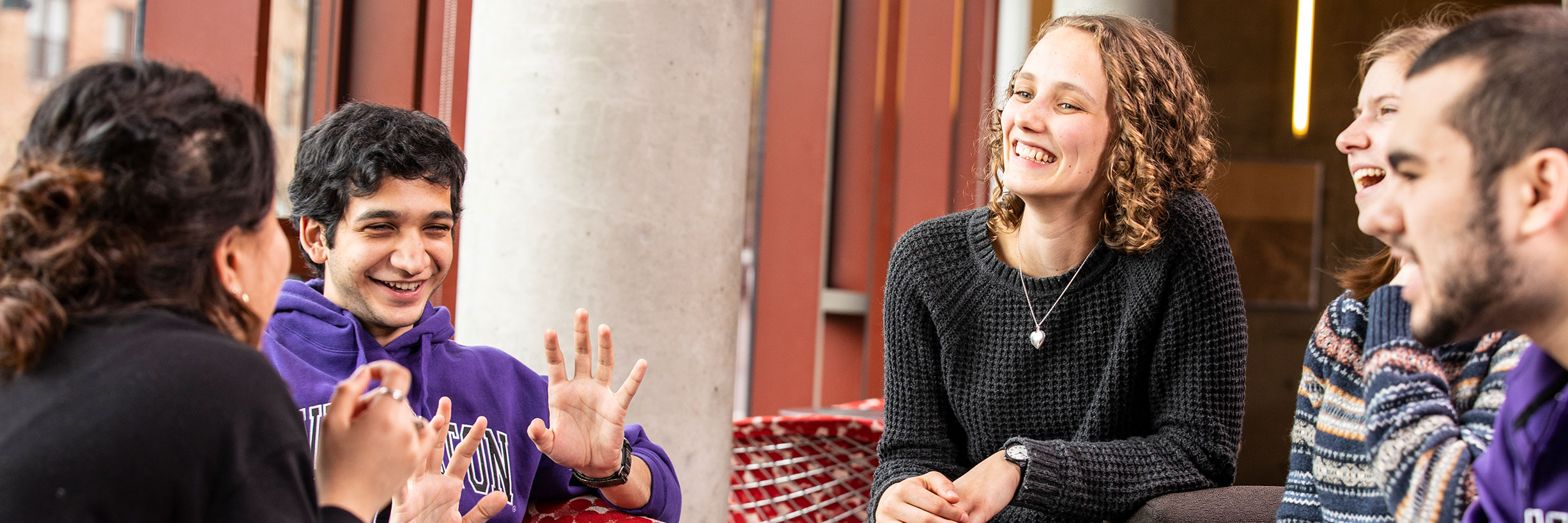Students sit together in a residential hall common area.