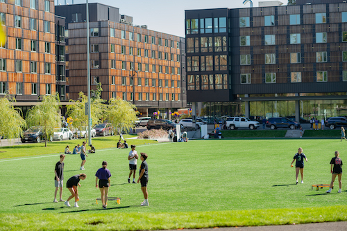 Students playing Spikeball on Denny Field
